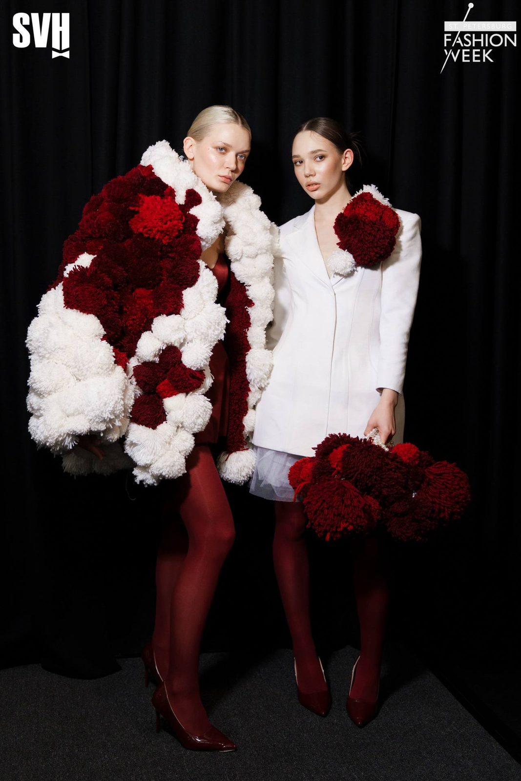 Backstage at SPBFW: two models in red and white pompom looks, dewy skin