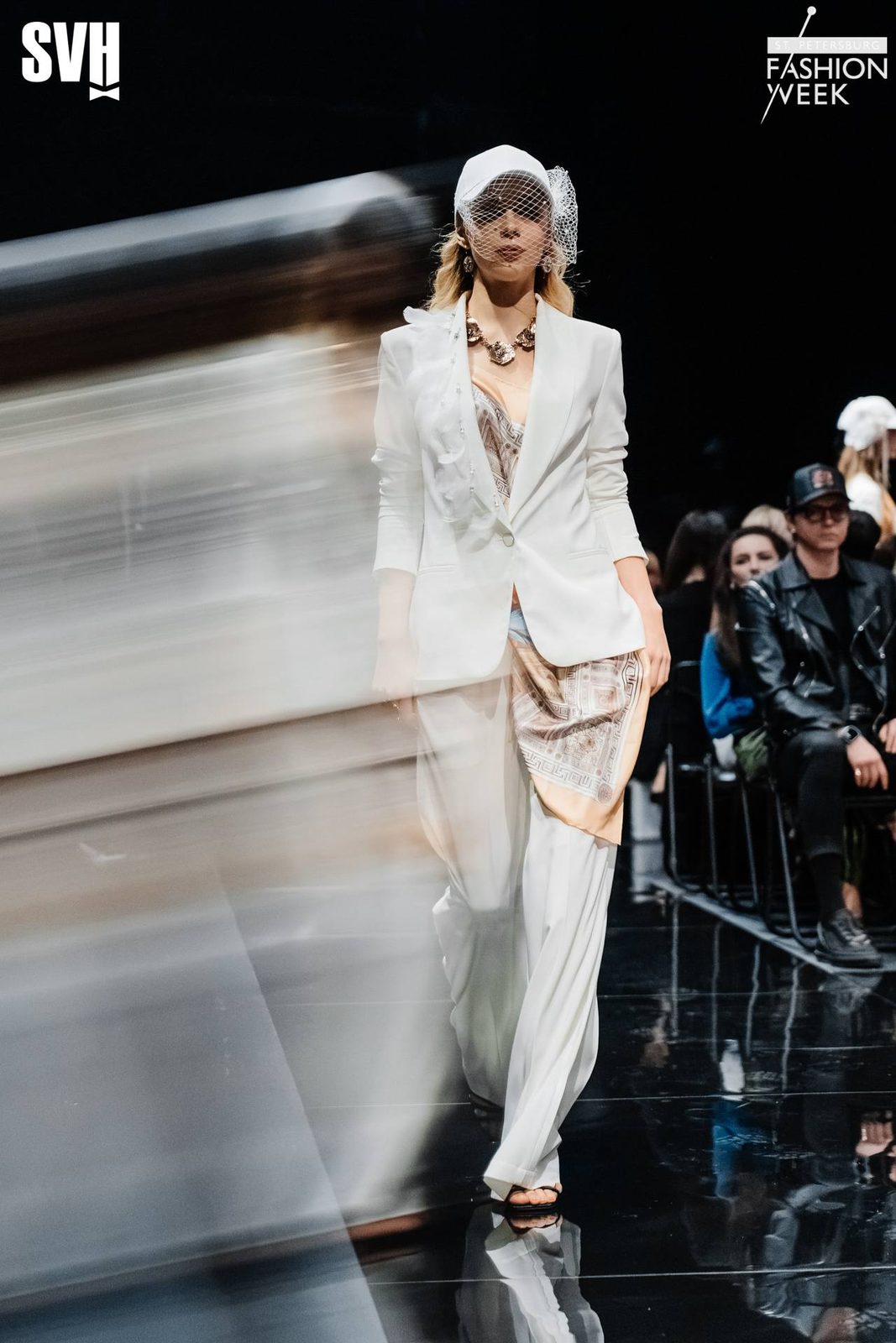 Runway at SPBFW: white suit, cap with birdcage veil