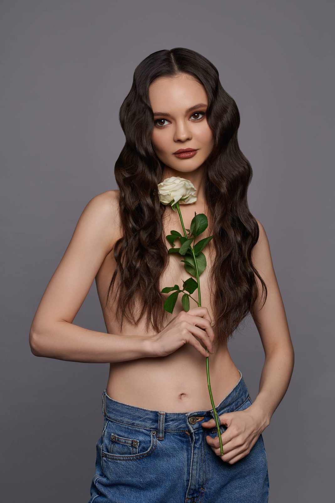 Full portrait with a white rose and denim