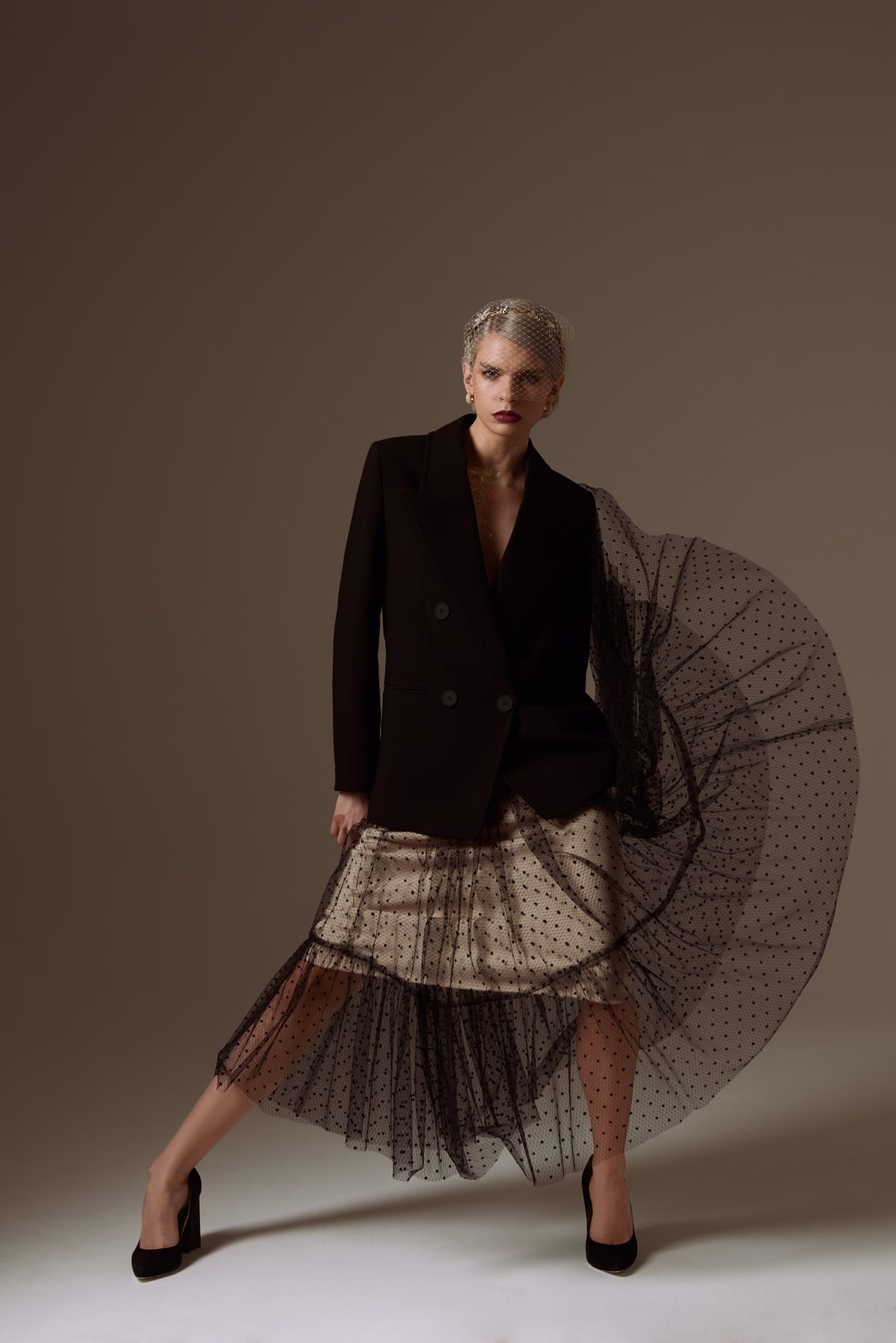 Fashion portrait: tailored jacket and tulle skirt