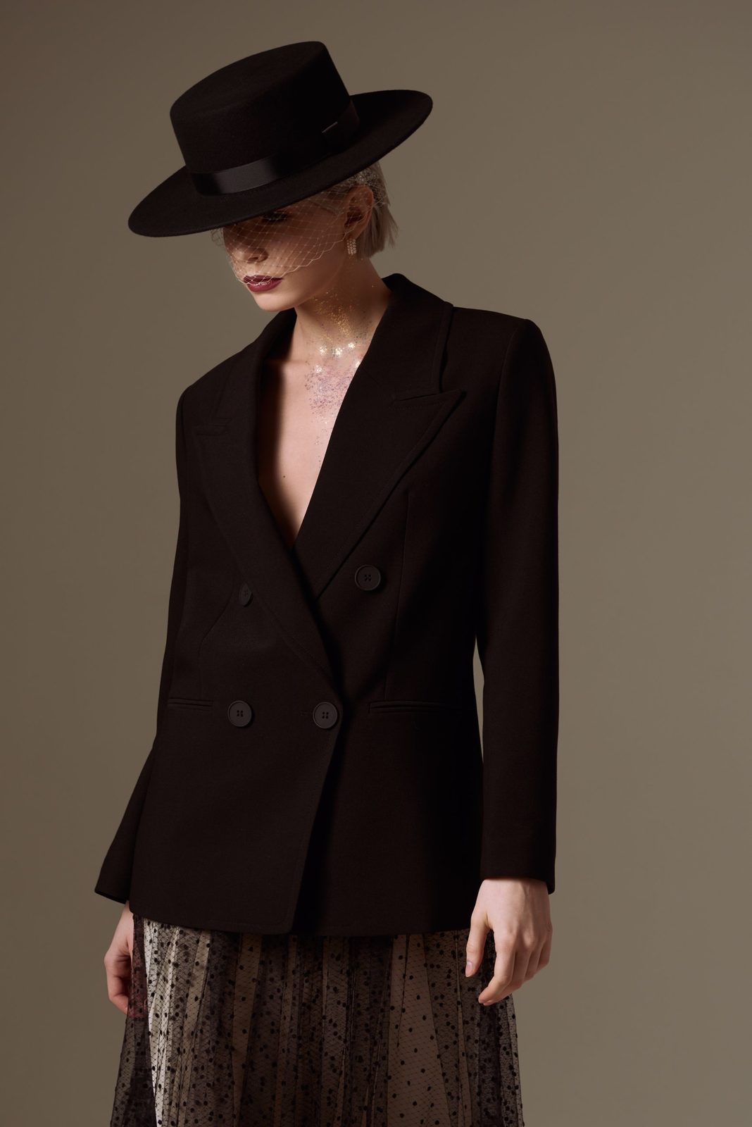Black boater hat, veil and double-breasted jacket